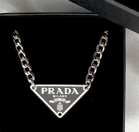 prada choker|Prada symbol necklace.